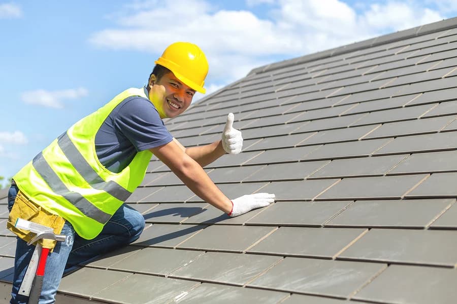 Roofing contractor giving a thumbs up